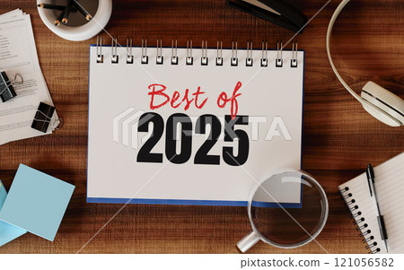 Best of 2025 journal with office supplies and headphones, 3D render. 121056582