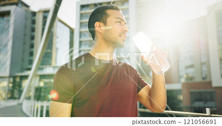 Man, drinking water and athlete thinking in city, liquid nutrition and sports drink for fitness. Male person, sun flare and bottle of h2o for refreshing rest in urban town, dream and exercise goals 121056691