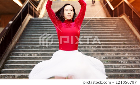 Woman, ballet and dancing in city, stairs and creative at park, tutu and outdoor for performance. Person, ballerina and balance with moving, rhythm and concert with talent for street art in Japan Woman, ballet and dancing in city, stairs and creative at park, tutu and outdoor for performance. Person, ballerina and balance with moving, rhythm and concert with talent for street art in Japan 121056797