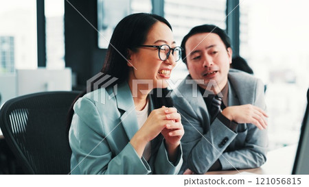 Japanese, business people and collaboration in office for feedback, review and teamwork for project. Woman, man and together for partnership, conversation and career in management for finance company Japanese, business people and collaboration in office for feedback, review and teamwork for project. Woman, man and together for partnership, conversation and career in management for finance company 121056815