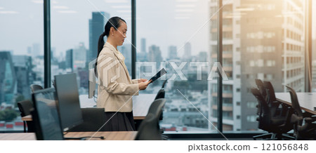 Profile, business or woman in office, file or financial report with corporate professional. Asian person, technology or accountant in workplace, investment company or employee with paperwork in Japan Profile, business or woman in office, file or financial report with corporate professional. Asian person, technology or accountant in workplace, investment company or employee with paperwork in Japan 121056848
