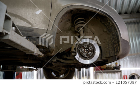 Auto repair station with a disassembled car. Car repair in a car service. 121057387