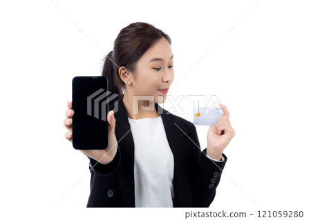Portrait young asian businesswoman holding credit card and smartphone smiling isolated. Portrait young asian businesswoman holding credit card and smartphone smiling isolated. 121059280
