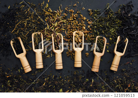 Colorful mix of tea varieties: red and black, green and white, oolong and herbal Colorful mix of tea varieties: red and black, green and white, oolong and herbal 121059513