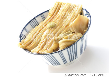Conger eel rice bowl topped with wasabi and pickled ginger photographed on a white background Conger eel rice bowl topped with wasabi and pickled ginger photographed on a white background 121059910