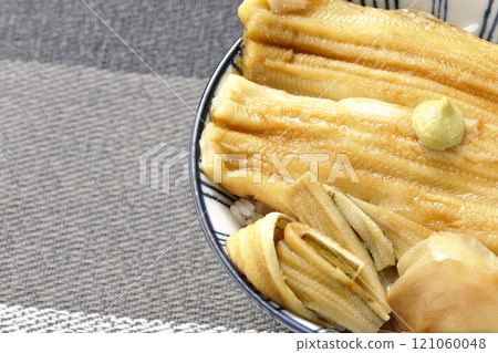 Conger eel rice bowl topped with wasabi and pickled ginger Conger eel rice bowl topped with wasabi and pickled ginger 121060048