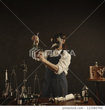 Carefully measuring spice or herb into large jar, plague doctor appears to be creating tincture or infusion, surrounded by classic laboratory tools. 121060700