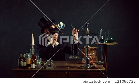 Alchemist-inspired plague doctor immersed in work, balancing old-fashioned scales in vintage laboratory against dark mystery background. Alchemist-inspired plague doctor immersed in work, balancing old-fashioned scales in vintage laboratory against dark mystery background. 121060723