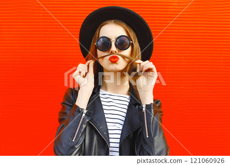Fashion portrait funny young woman shows mustache hair blowing red lips kiss having fun 121060926
