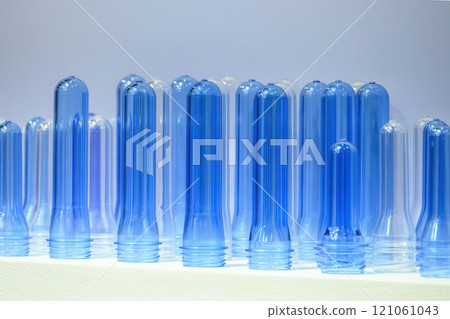 Close up scene of group of preform shape of PET bottle products. Close up scene of group of preform shape of PET bottle products. 121061043
