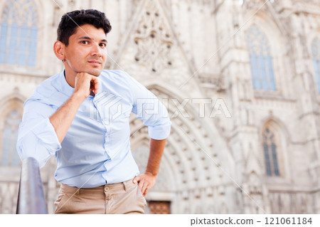 yYoung European guy in blue shirt walking around city yYoung European guy in blue shirt walking around city 121061184