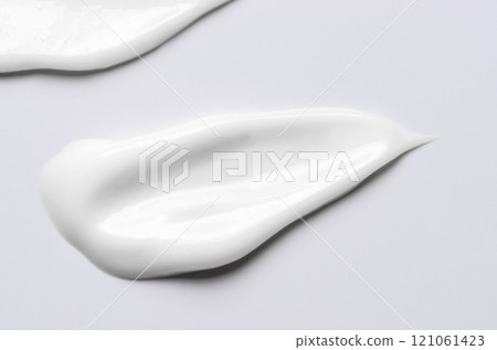A sample of a white moisturizing cosmetic cream for the body or face 121061423