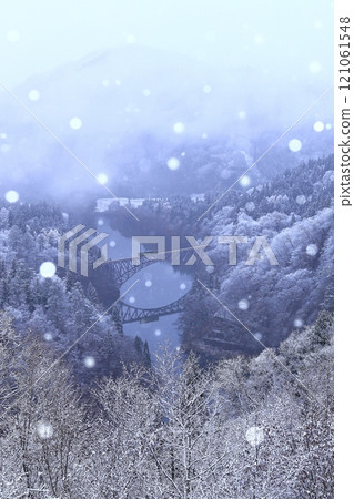 Snow falling on the Tadami Line 121061548