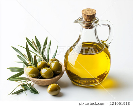 Olive oil in a glass bottle with olives isolated on a white background 121061918