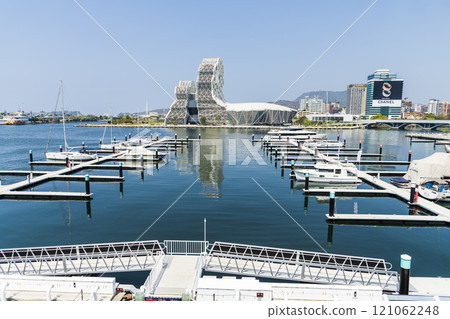 View of Yacht Marina at Glory Pier of Kaohsiung Port, Taiwan. with the Kaohsiung Music Center building. View of Yacht Marina at Glory Pier of Kaohsiung Port, Taiwan. with the Kaohsiung Music Center building. 121062248