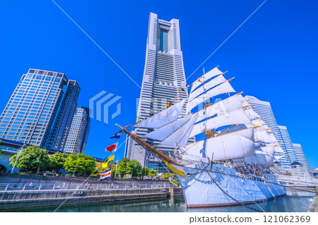 Yokohama cityscape in Japan: Towards a new era...View of the Nippon Maru with full sails and Yokohama Landmark Tower. A ray of hope = 3rd Yokohama cityscape in Japan: Towards a new era...View of the Nippon Maru with full sails and Yokohama Landmark Tower. A ray of hope = 3rd 121062369