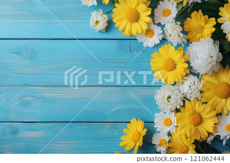 A old wooden plank background with a variety of yellow and white flowers, including daisies on the sides. A old wooden plank background with a variety of yellow and white flowers, including daisies on the sides. 121062444