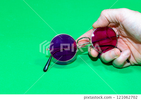 3D sunglasses on a green background 121062702