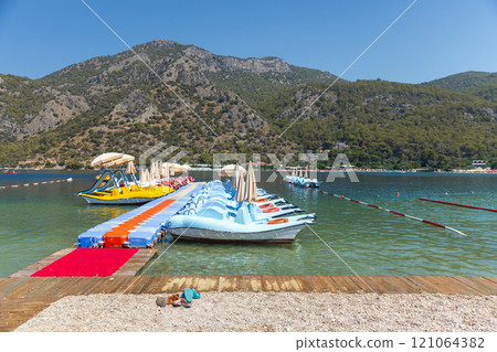 Blue Lagoon beach view with moored pleasure boats, Turkey 121064382