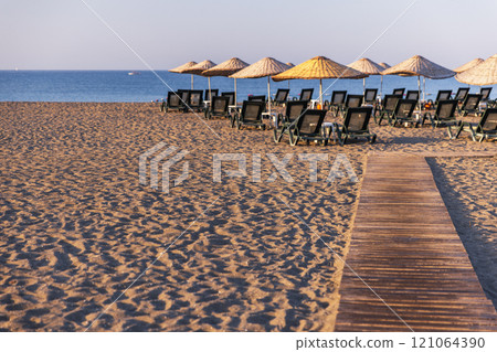 Sarigerme beach, Turkey. Aegean sea coast with umberellas Sarigerme beach, Turkey. Aegean sea coast with umberellas 121064390