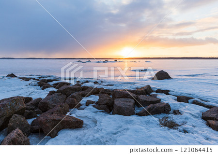 Granite rocks are covered with snow. Winter landscape 121064415