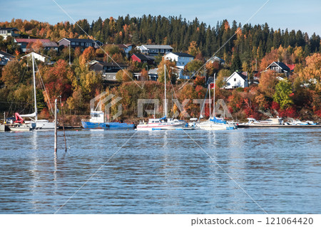 Motorboats and yachts moored in Norwegian marina Motorboats and yachts moored in Norwegian marina 121064420