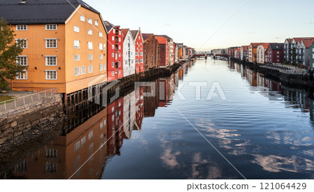 Perspective view of Nidelva river with colorful old wooden houses Perspective view of Nidelva river with colorful old wooden houses 121064429