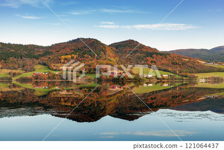 Norwegian landscape with hills and small coastal villages 121064437
