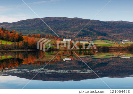 Norwegian landscape with hills and small coastal villages Norwegian landscape with hills and small coastal villages 121064438