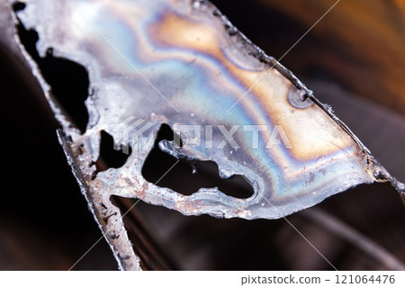 Abstract steel object with tempering colors pattern Abstract steel object with tempering colors pattern 121064476