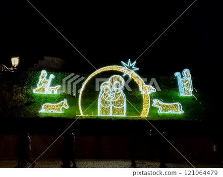 Christmas. Light. Christmas lights through the streets of Madrid. Decorating streets of the city. Fir tree with Christmas lights. Christmas ball. On. MADRID. SPAIN. 11 December 2024. 121064479