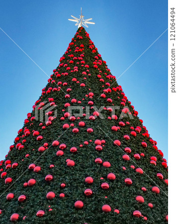 Christmas. Light. Christmas lights through the streets of Madrid. Decorating streets of the city. Fir tree with Christmas lights. Christmas ball. On. MADRID. SPAIN. 11 December 2024. 121064494
