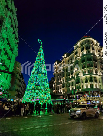 Christmas. Light. Christmas lights through the streets of Madrid. Decorating streets of the city. Fir tree with Christmas lights. Christmas ball. On. MADRID. SPAIN. 11 December 2024. 121064500