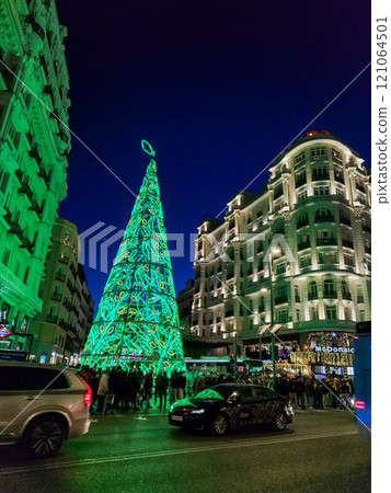 Christmas. Light. Christmas lights through the streets of Madrid. Decorating streets of the city. Fir tree with Christmas lights. Christmas ball. On. MADRID. SPAIN. 11 December 2024. Christmas. Light. Christmas lights through the streets of Madrid. Decorating streets of the city. Fir tree with Christmas lights. Christmas ball. On. MADRID. SPAIN. 11 December 2024. 121064501