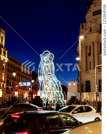 Christmas. Light. Christmas lights through the streets of Madrid. Decorating streets of the city. Fir tree with Christmas lights. Christmas ball. On. MADRID. SPAIN. 11 December 2024. 121064506