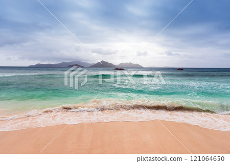 La Digue beach is under dramatic sky on a cloudy day 121064650