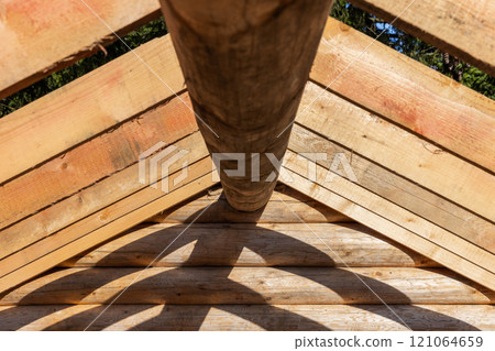 Wooden house is under construction. Background photo 121064659