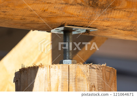 Close up photo of bolted adjustable connection of a beam and column 121064671