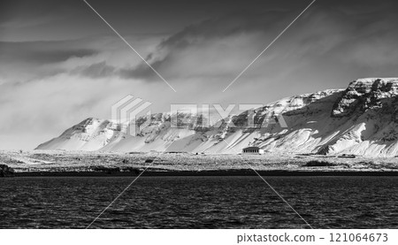 Icelandic landscape with snowy coastal mountains 121064673