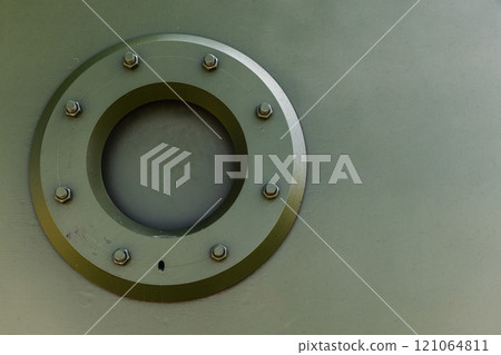 Khaki green background photo texture. Locked round viewing window 121064811