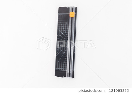top view of a paper trimmer to cut paper and scrapbooking. tool for precise cutting in crafting, office work, and other applications. white background, 121065253