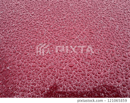 Water ice drops on red background 121065859
