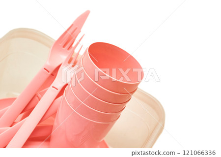 Plastic pink fork,cups,spoon,knife for camping, isolated on white Plastic pink fork,cups,spoon,knife for camping, isolated on white 121066336