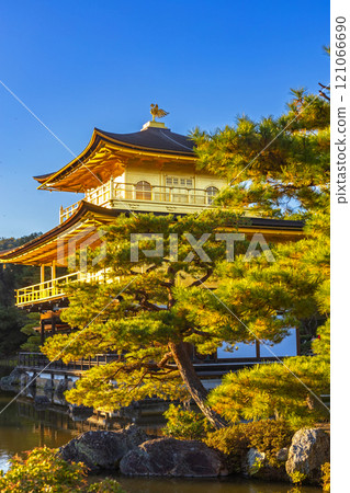 Beautiful of Kinkakuji temple or the golden Pavilion by the the pond surrounded with Japanese garden in Autumn season at Kyoto,Japan 121066690