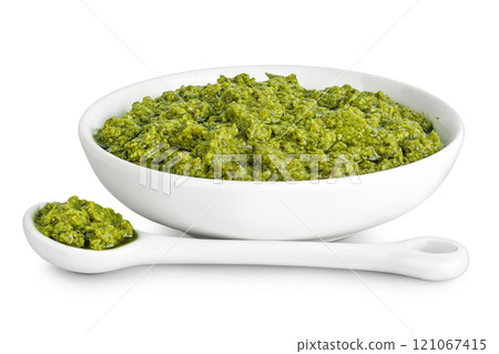Pesto sauce in ceramic bowl isolated on white background 121067415