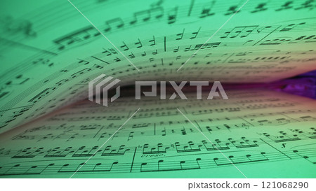 Macro background of saved medieval book with ancient musical notes writings, Glowing Neon Light Macro background of saved medieval book with ancient musical notes writings, Glowing Neon Light 121068290