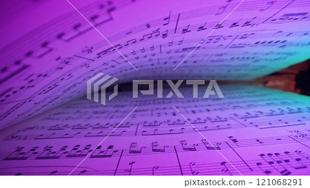 Macro background of saved medieval book with ancient musical notes writings, Glowing Neon Light 121068291