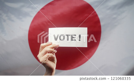 Woman Holding Title Sign With Text Vote On Japanese Flag Background. General  121068335