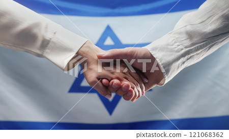 Hands Of Woman And Man Reach Out Each Other On Israeli Flag Background. Israel  121068362