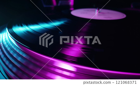 Classic Vinyl Record Playing With neon light at night. Macro. Turntable spin, LP Classic Vinyl Record Playing With neon light at night. Macro. Turntable spin, LP 121068371